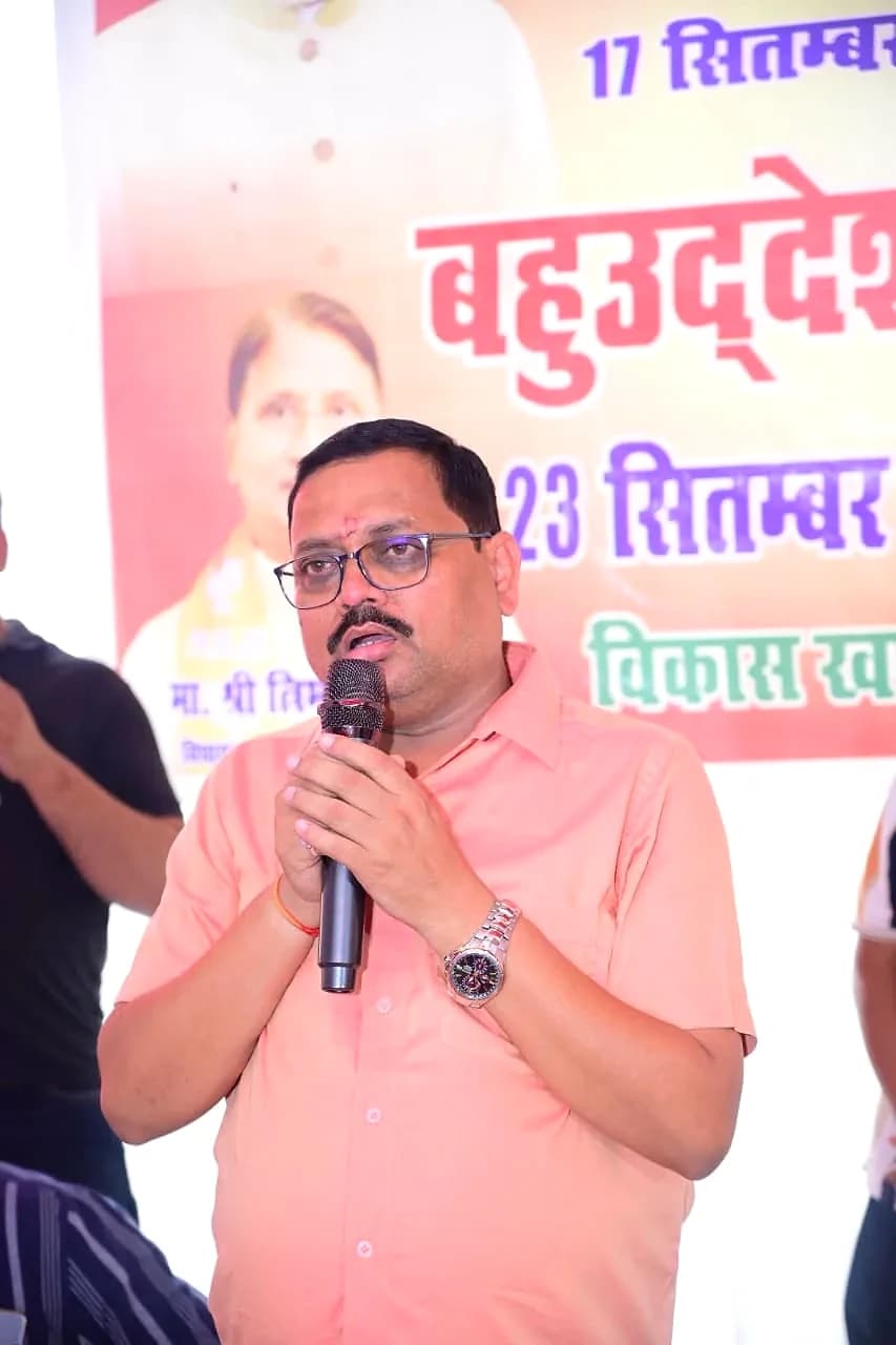 Vinod Kumar Upadhyay addressing a public programme, microphone in hand